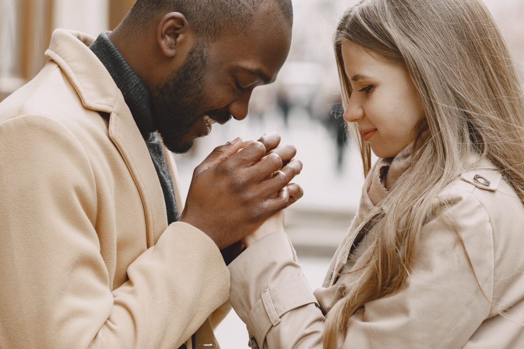 mixed couple spenting time together in a spring city