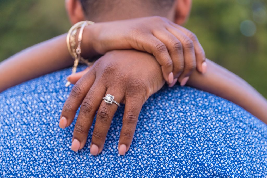 shallow focus closeup of the couple hugging on their engagement in kennesaw mountain in marietta